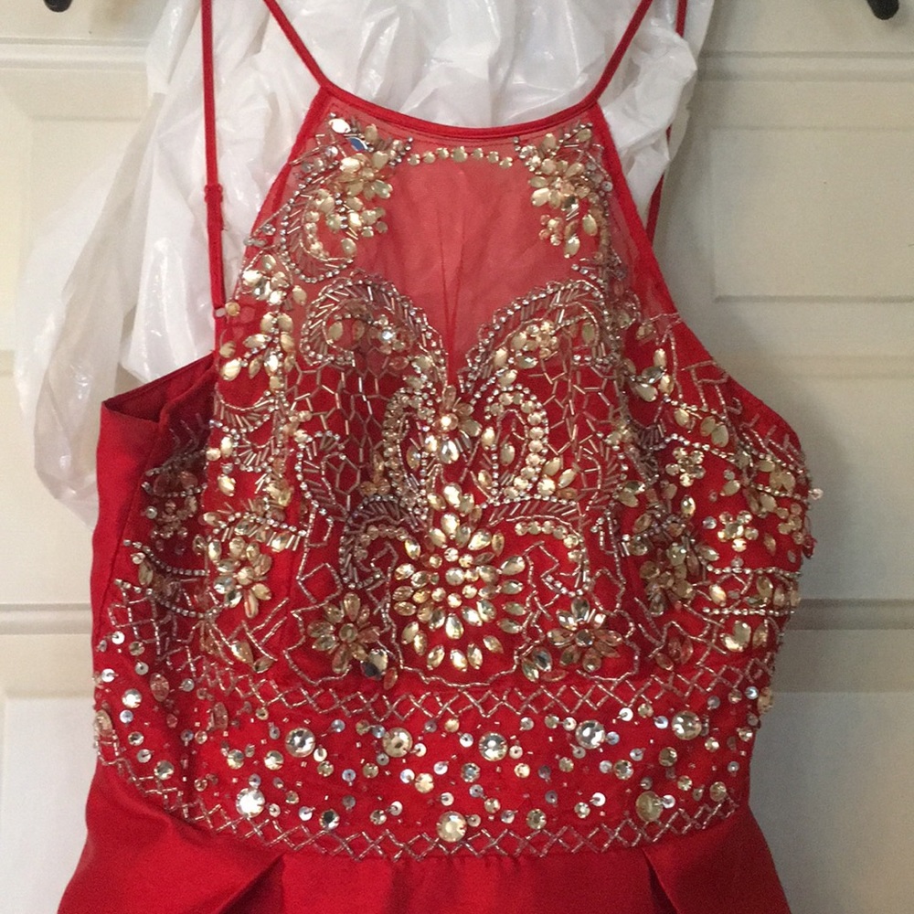 Red dress with gold and silver jewels